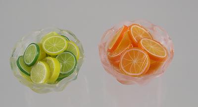 2 Bowls of Sliced Lemon- Limes and Oranges for