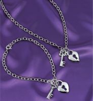 Solid silver lock and key charm on a silver link chain. Chain length 41cm (16&quote;)